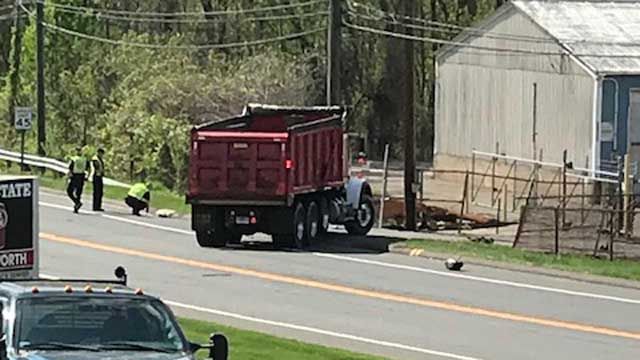 A motorcycle and dump truck collided in Enfield on Tuesday afternoon (WFSB)